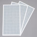 A group of white paper with white squares and grid.