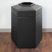 A black hexagonal PolyTec waste container with an open top.