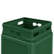 A green plastic Commercial Zone PolyTec waste container with dome lid and two holes in the top.