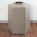 A beige hexagonal Commercial Zone waste container with an open top.