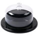 A black round tray with a clear lid containing a black and clear dome.