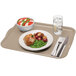 A taupe Cambro rectangular fiberglass cafeteria tray with food, a fork, and a knife.