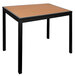 A BFM Seating Longport square black aluminum table with a synthetic teak top.