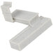 A white plastic Cambro Camshelving corner connector with black specks.