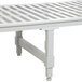 A white plastic Cambro dunnage stand with metal legs.