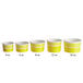 A row of yellow Choice paper cups with measurements for frozen yogurt.