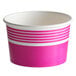 A pink and white paper cup with stripes on the side.