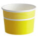 A yellow and white paper cup with a stripe design.