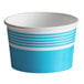 A close up of a blue and white striped paper cup with a blue and white bowl in the background.