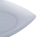 A close-up of a white Fineline square dessert plate.