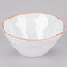 A white melamine bowl with a brown speckled rim.