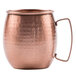A Clipper Mill hammered copper Moscow Mule mug with a handle.