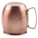 A Clipper Mill hammered copper Moscow mule mug with a handle.