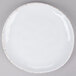 A white plate with gold trim.