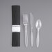 A black napkin and clear plastic silverware set with Visions brand napkin and silverware.