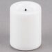 A white Sterno real wax mini votive candle with a black tip.