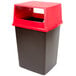 A black and red Rubbermaid Glutton trash can with a red lid.