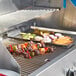Crown Verity mobile outdoor grill with meat and vegetables cooking on it.