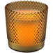 A Sterno amber flameless wax filled glass lamp with a honeycomb pattern on the glass base.