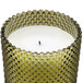 A Sterno green flameless wax filled glass candle with hobnail design.