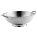 A silver Vollrath stainless steel colander with handles and a base.
