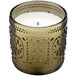 A Sterno green glass flameless candle lamp with a decorative design.