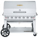 A silver Crown Verity propane barbecue grill on wheels.