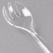 A clear plastic serving fork.