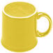 A yellow Fiesta java mug with a yellow handle.