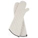 A pair of white San Jamar terry oven mitts with a quilted design.