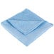 A blue Unger SmartColor Microfiber cleaning cloth folded on a white background.