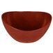 A red Osslo melamine bowl with brown specks.