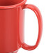 A close up of a red GET Sensation Tritan mug with a handle.