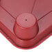 A red polypropylene tray with cup holders.
