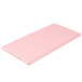 A folded pink Creative Converting table cover