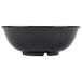A black round melamine bowl with a white background.