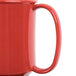 A close up of a red GET Tritan plastic two handle mug.
