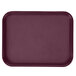 A close up of a burgundy rectangular GET fast food tray with a textured surface.