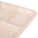 A tan polypropylene tray with six compartments.