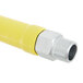 A yellow and silver T&S Safe-T-Link gas appliance connector hose with a silver pipe.