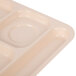 A close-up of a tan polypropylene tray with 6 compartments.