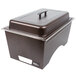 A brown metal Sterno chafer with lid on a counter.