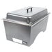A Sterno silver metal chafer with lid and pans on a counter.