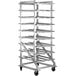 A white metal Regency can rack with many shelves on wheels.