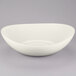 A white GET Osslo melamine bowl on a gray surface.