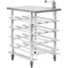 A Regency mobile aluminum can rack with stainless steel top and four shelves on wheels.