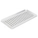 A white plastic drip tray with a metal grate.