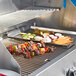 Crown Verity outdoor grill with meat and vegetables cooking on it.
