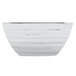 A white Vollrath square serving bowl with a silver rim.