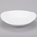 A white Libbey Infinity oval porcelain bowl.